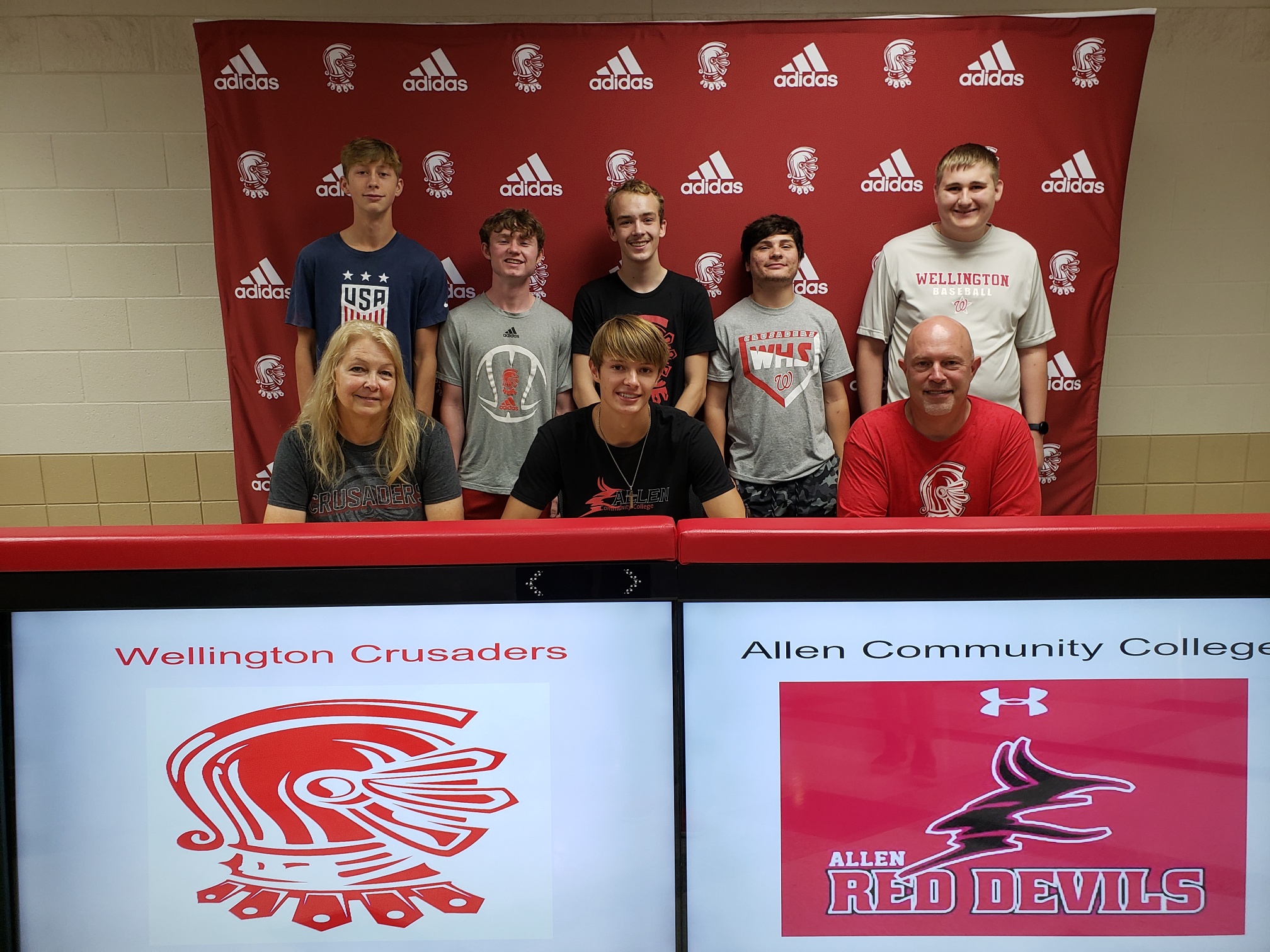 Tanner Meyer signing at WHS to attend Allen County to play basketball